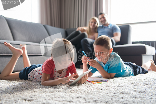 Image of young couple spending time with kids