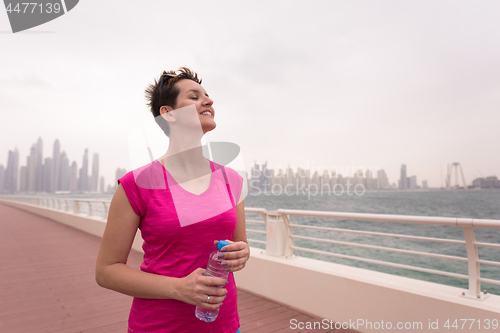 Image of young woman celebrating a successful training run