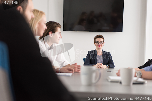 Image of Group of young people meeting in startup office