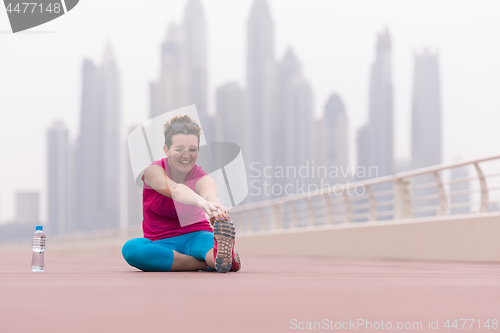 Image of woman stretching and warming up