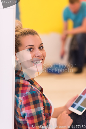 Image of couple doing home renovations