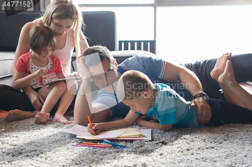 Image of young couple spending time with kids