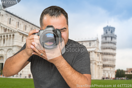 Image of Hispanic Male Photographer With Camera at Leaning Tower of Pisa