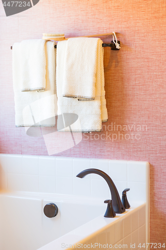 Image of New Modern Bathtub, Faucet and Towels Hanging Abstract