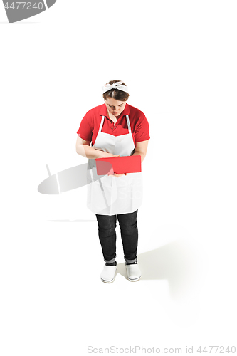 Image of Portrait of cute smiling woman with laptop in her hands in the studio, isolated on white background