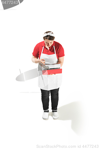 Image of Portrait of cute smiling woman with laptop in her hands in the studio, isolated on white background