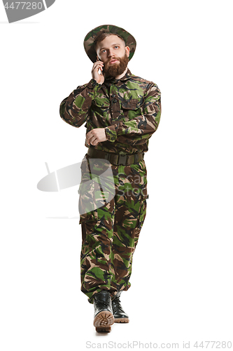 Image of Young army soldier wearing camouflage uniform isolated on white