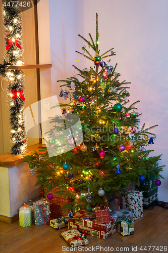Image of Decorated Christmas tree at home.