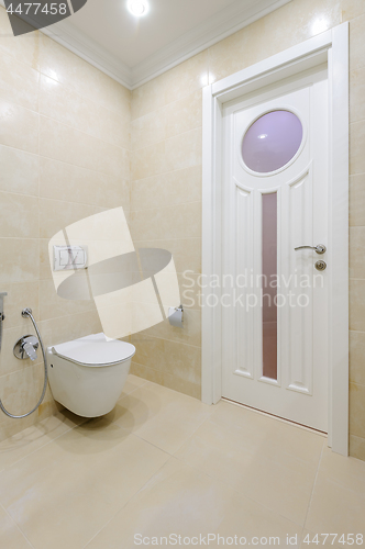 Image of Bright bathroom interior with toilet