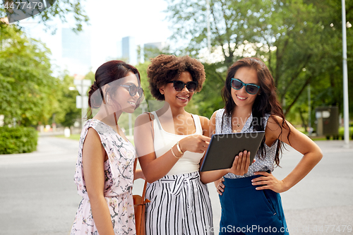 Image of women with tablet pc on street in summer