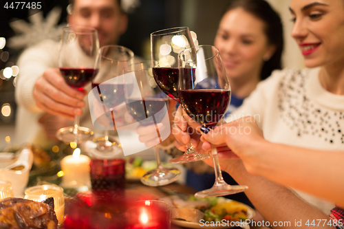 Image of close up of friends with wine celebrate christmas
