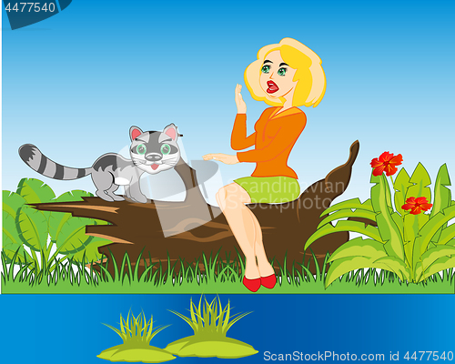 Image of Girl with cat on nature beside yard
