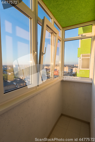 Image of A small glazed balcony in the apartment of a multi-storey residential building