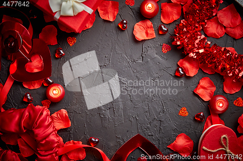 Image of Red roses petals, candles, dating accessories, boxed gifts, hearts, sequins