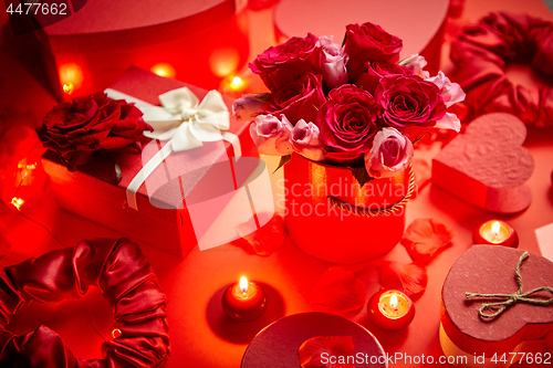 Image of Valentines day romantic decoration with roses, boxed gifts, candles