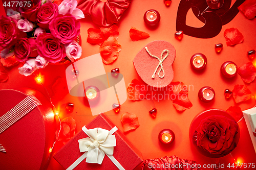 Image of Valentines day romantic decoration with roses, boxed gifts, candles