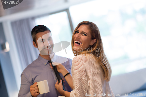 Image of A young couple is preparing for a job and using a laptop