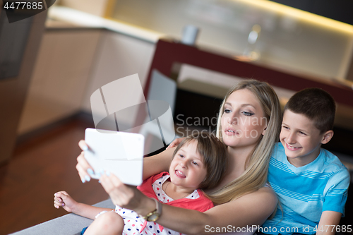 Image of Young Family Using A Tablet To Make Future Plans