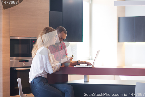 Image of happy young couple buying online