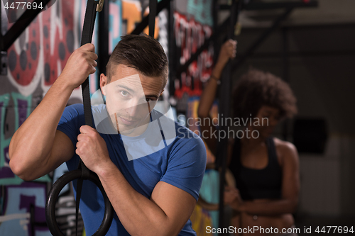 Image of Portrait of multiethnic couple  after workout at gym