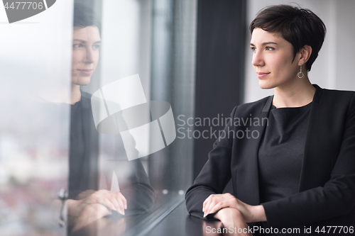 Image of Portrait of successful Businesswoman by the window