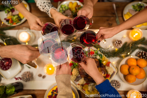 Image of close up of friends with wine celebrate christmas