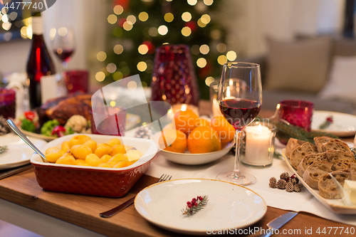 Image of glass of red wine and food on christmas table