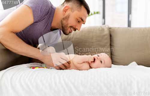 Image of close up of father with little baby at home