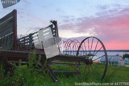 Image of Vintage Ancient Rusty Agriculture Equipment In The Countryside