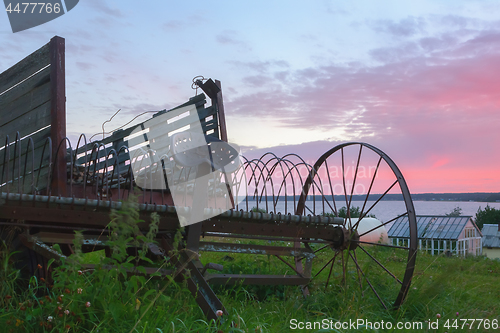 Image of Vintage Ancient Rusty Agriculture Equipment In The Countryside