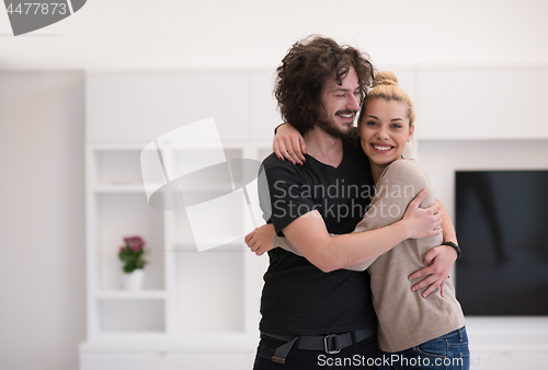 Image of couple hugging in their new home