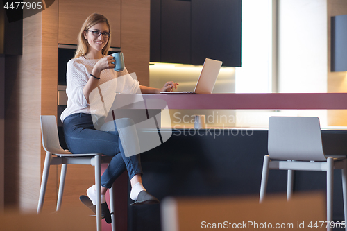 Image of woman drinking coffee enjoying relaxing lifestyle