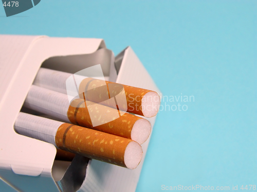 Image of Cigarettes over blue background.
