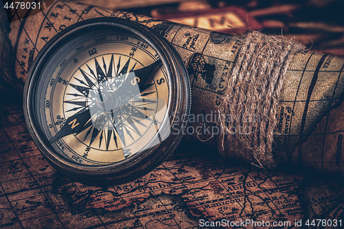 Image of Old vintage compass on ancient map