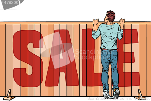 Image of a man looks over the fence. sale house real estate