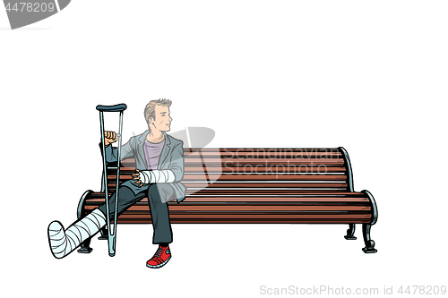 Image of man broken leg park bench