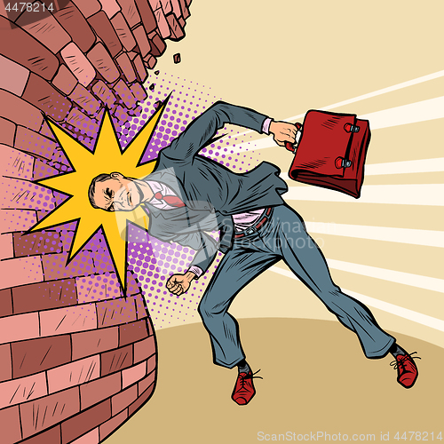 Image of businessman breaks the wall with his head