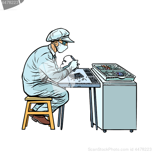 Image of Asian worker in electronics factory