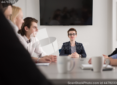 Image of Group of young people meeting in startup office