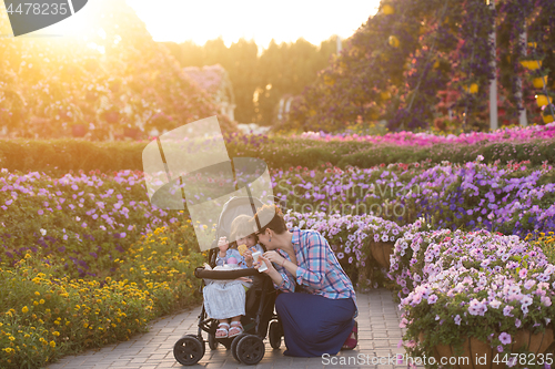 Image of mother and daughter in flower garden