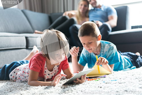 Image of young couple spending time with kids