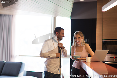 Image of A young couple is preparing for a job and using a laptop