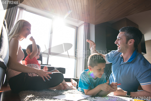 Image of young couple spending time with kids