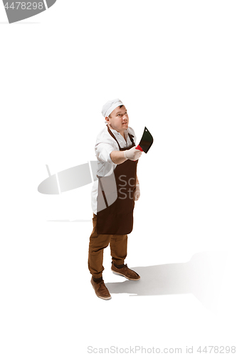 Image of Smiling butcher jumping with a cleaver isolated on white background