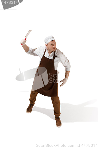 Image of Angry aggressive butcher posing with a cleaver isolated on white background