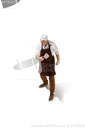 Image of Angry aggressive butcher posing with a cleaver isolated on white background