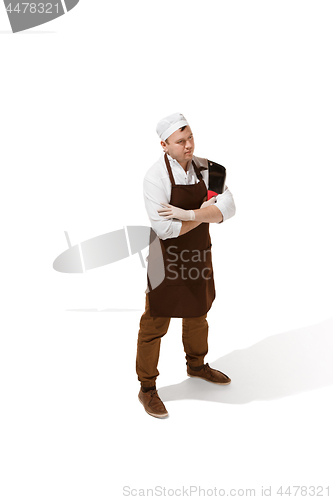 Image of Smiling butcher posing with a cleaver isolated on white background