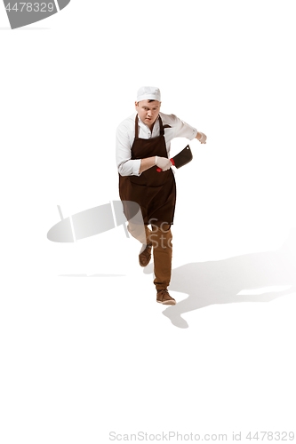 Image of Serious butcher running with a cleaver isolated on white background