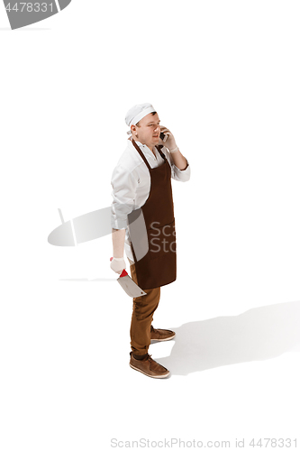 Image of Smiling butcher posing with a cleaver isolated on white background