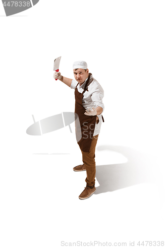 Image of Angry aggressive butcher posing with a cleaver isolated on white background